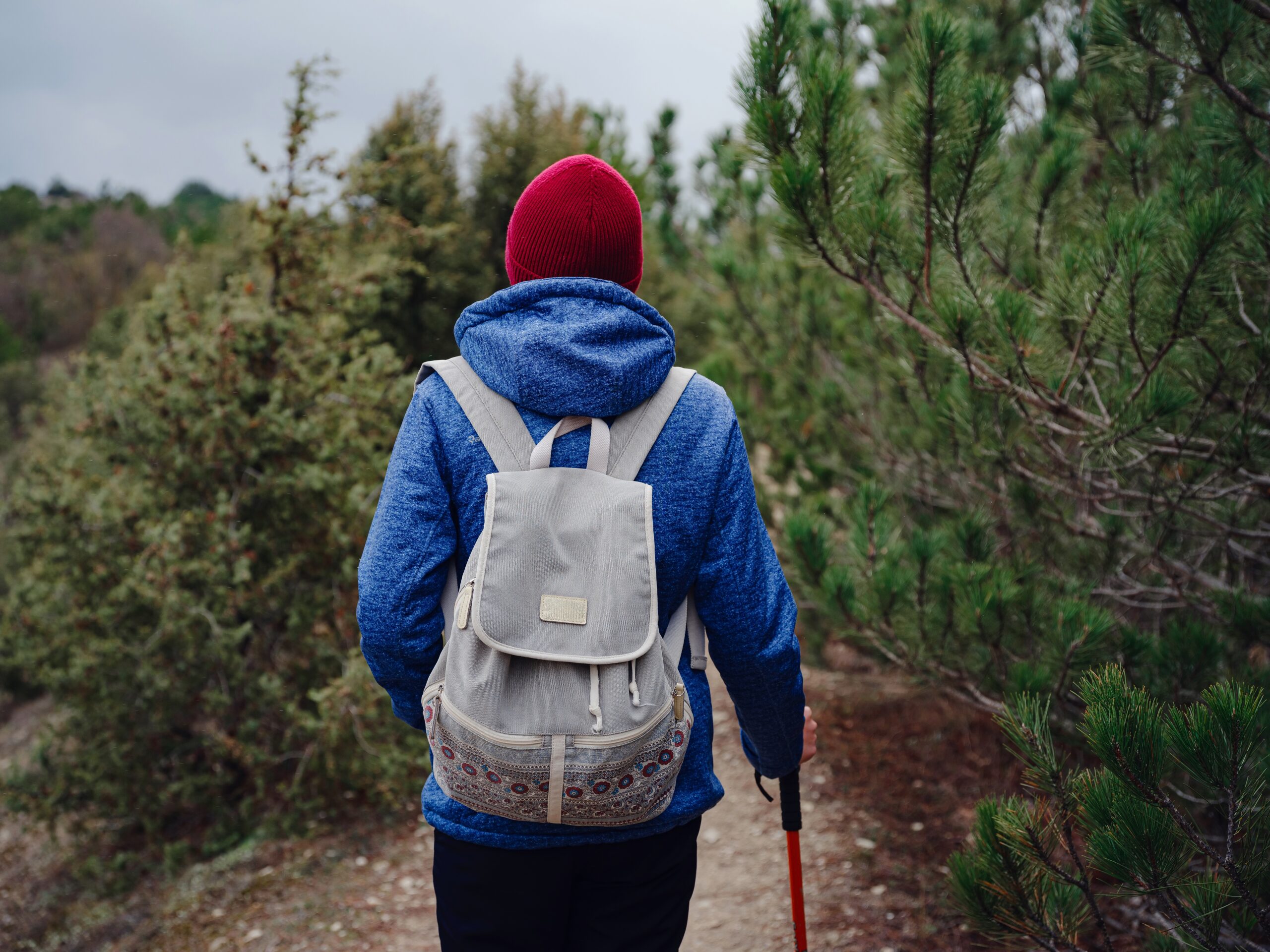 Portrait of woman hiker standing on the slope of mountain